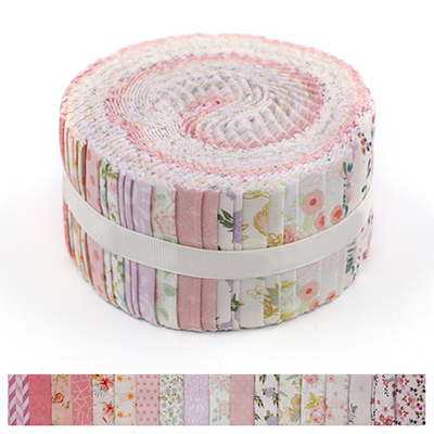 Jelly roll of fabric strips in various shades of pink with floral and geometric prints.