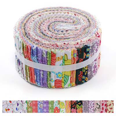 Colorful fabric strips rolled up into a compact bundle, showcasing various floral and geometric patterns.