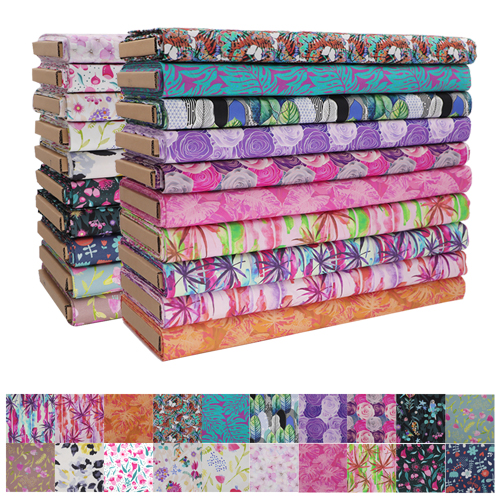 Stack of Quilting Fabrics in Various Colorful Designs