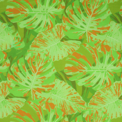 Fabric with a tropical leaf pattern in vibrant green and orange hues.