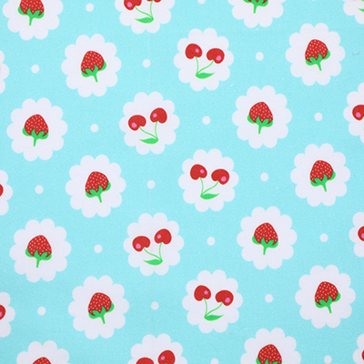 Light blue fabric with a pattern of strawberries and cherries, each fruit encased in a white scalloped circle, displayed flat without any scale reference.