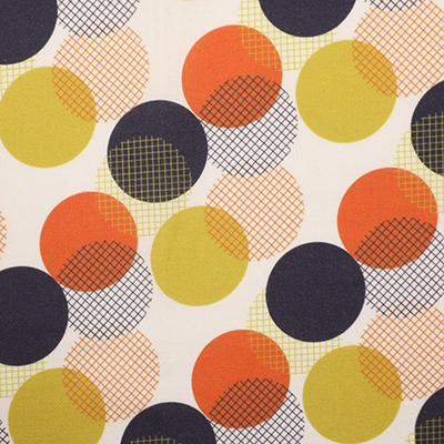 Fabric with overlapping large circles in black, orange, and yellow, featuring various grid patterns within each circle.